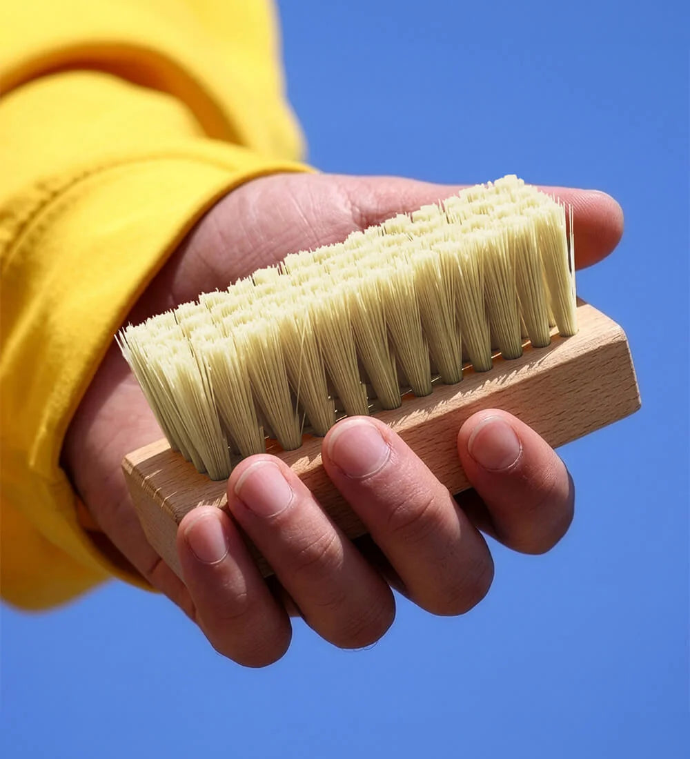 Man Holding SHOEGR Medium Shoe Brush