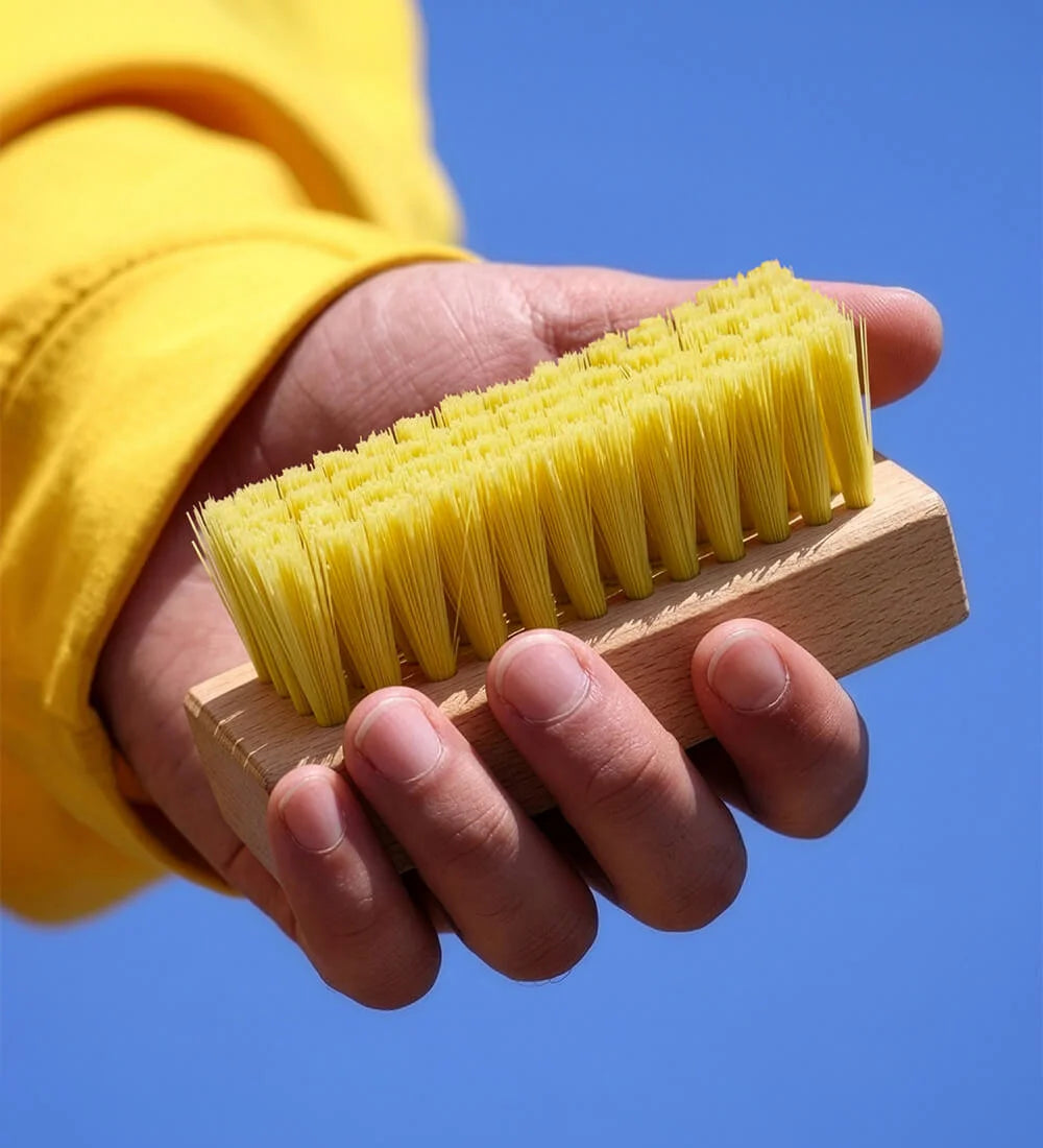Man Holding SHOEGR Soft Shoe Brush